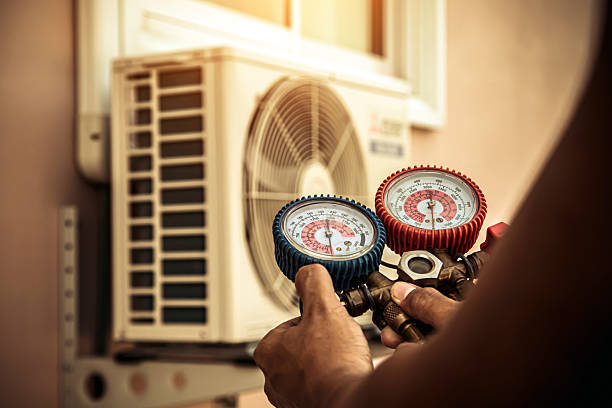 Professional Heat Pump Repair technician working in Poca, WV